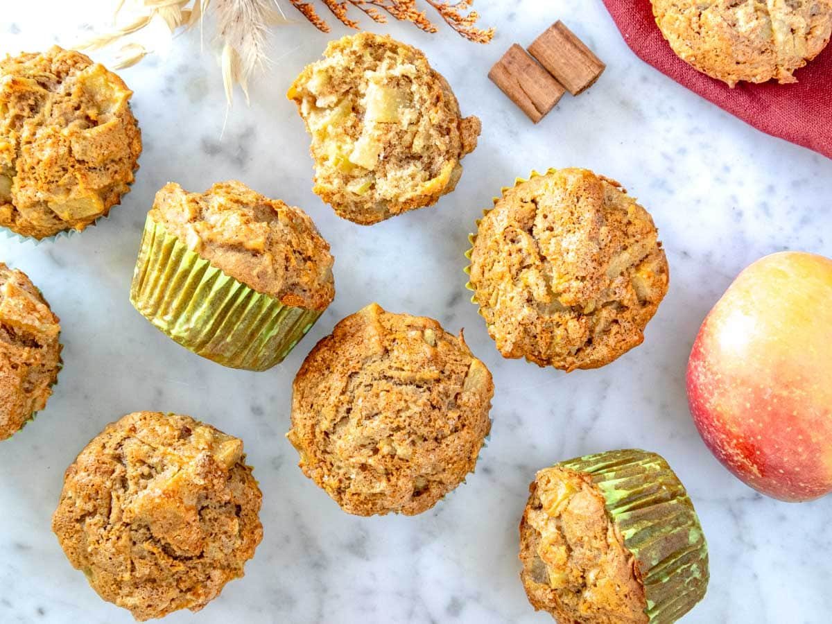 Apple muffins cooling down on a marble table