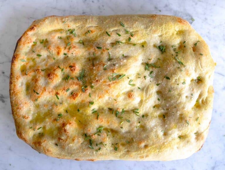 Schiacciata after baking on a marble surface