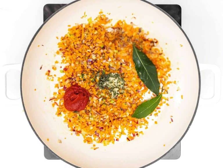 Step 1 Chopped onion carrot celery sauteฬing in pot to start Italian bean soup base.