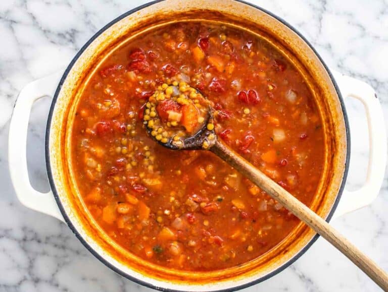 Step 2 Lentils simmering with vegetable broth, diced tomatoes, herbs, and spices.