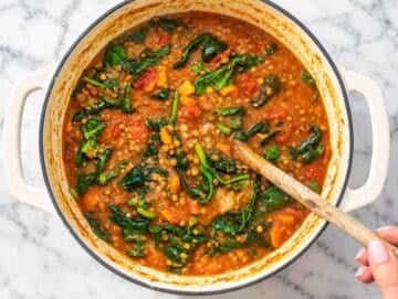 Step 4 Fresh spinach stirred into lentil vegetable soup until tender and wilted.