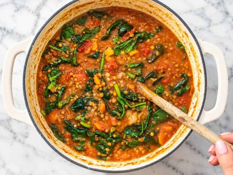 Step 4 Fresh spinach stirred into lentil vegetable soup until tender and wilted.