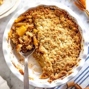 apple crumble with a silver spoon