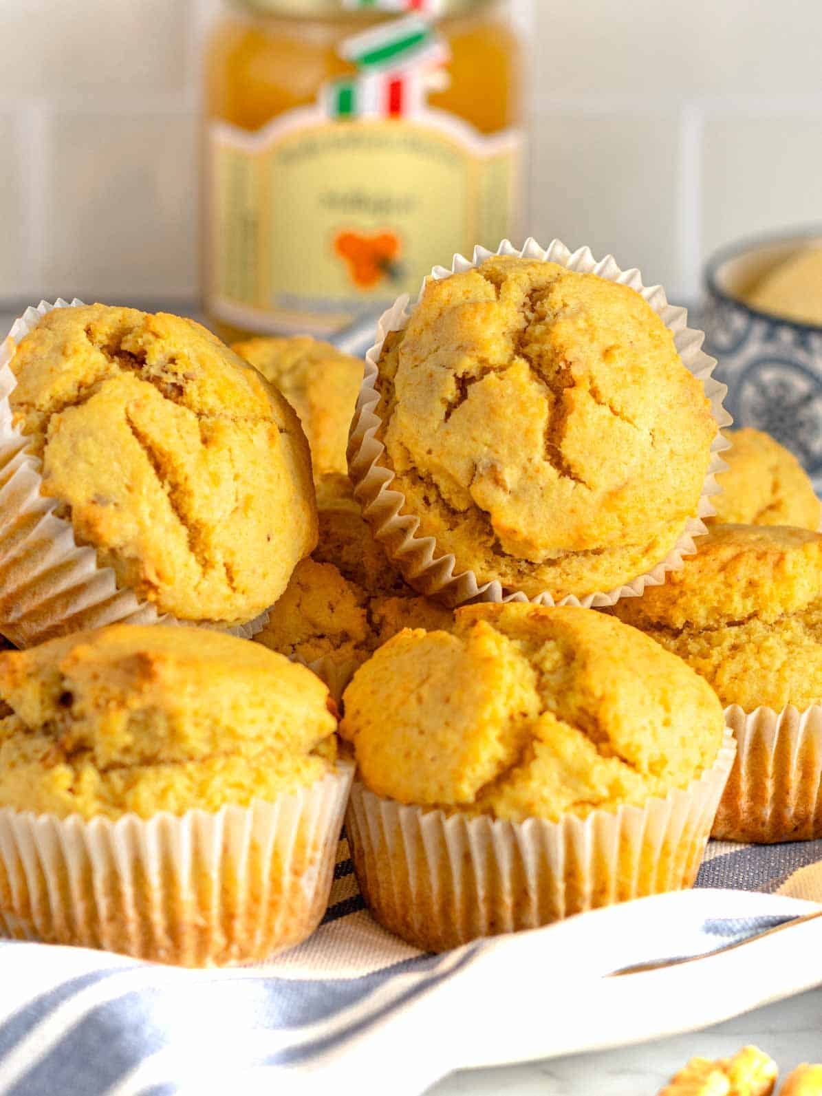 cornbread muffins with honey in the background