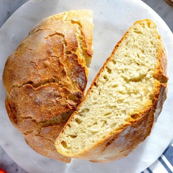 homemade bread cut in half with a perfect crumb