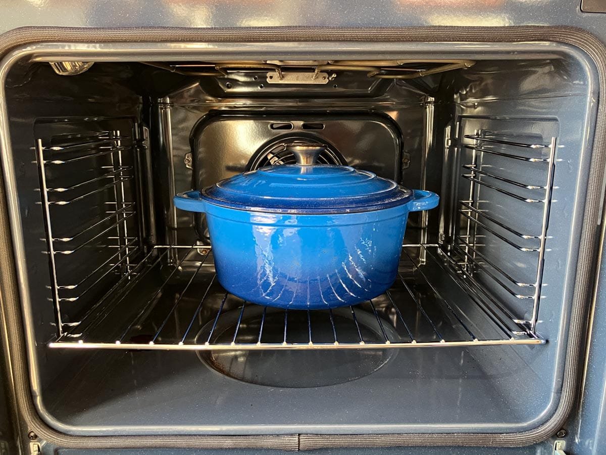 Dutch oven preheating in a regular oven.