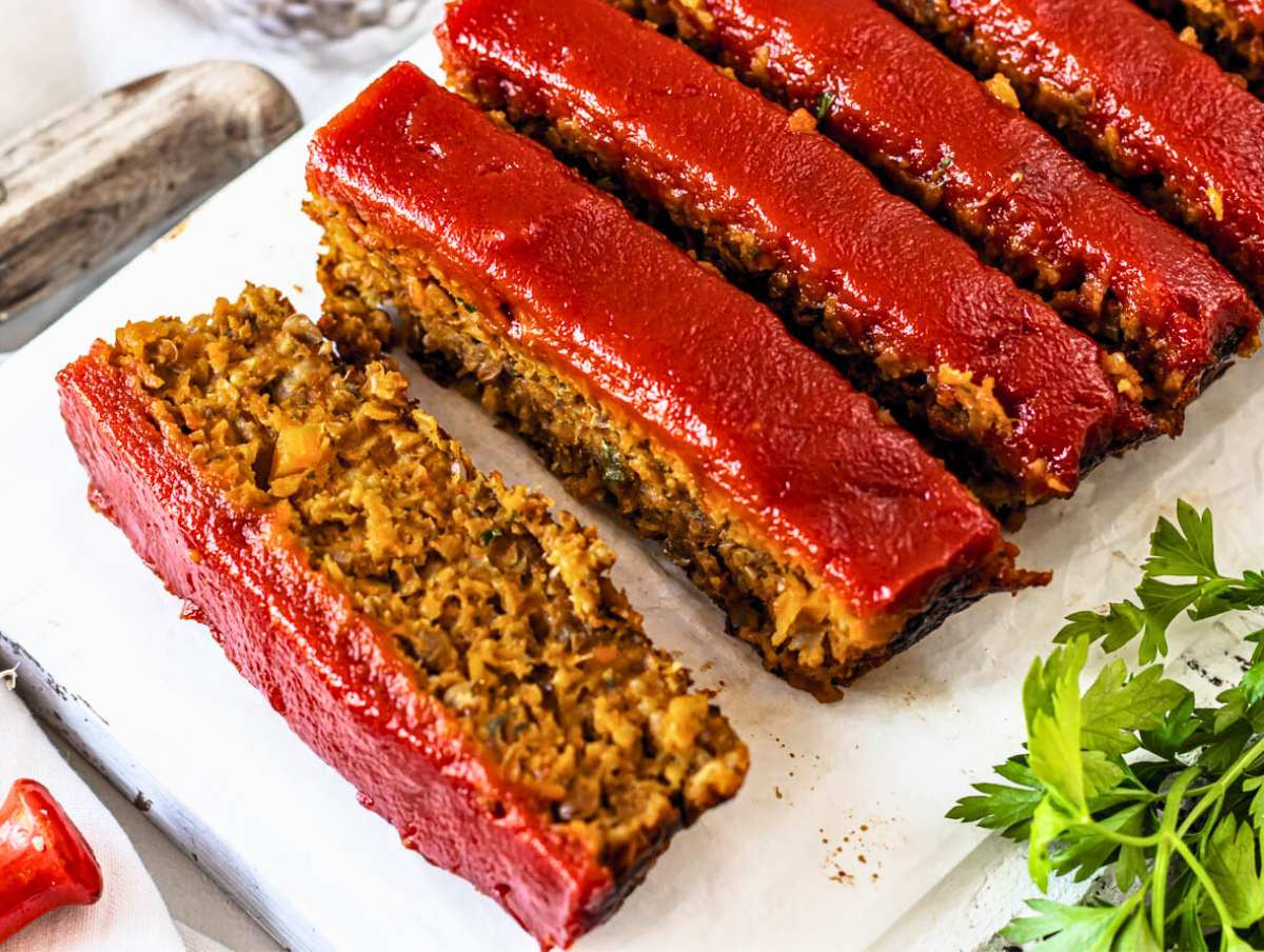 sliced lentil loaf on a cutting board