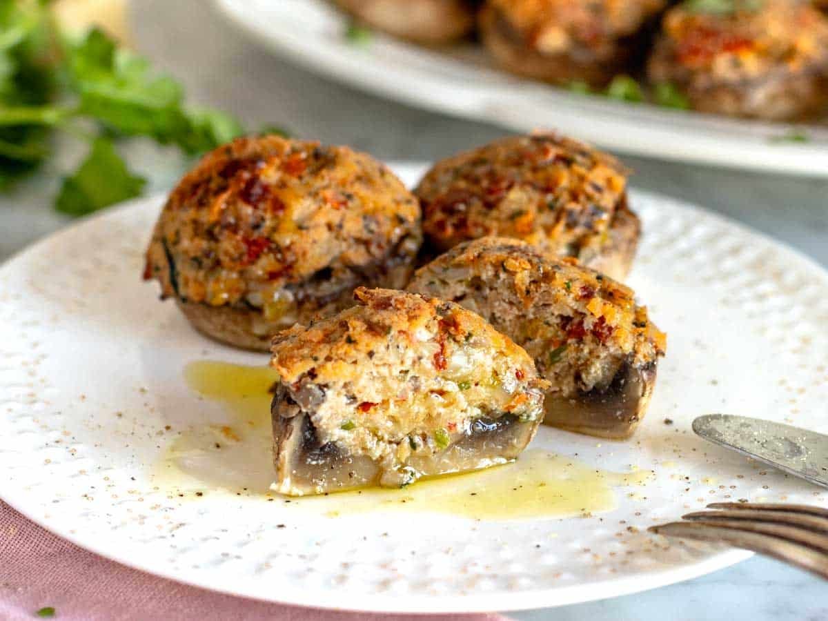 stuffed mushrooms cut open on a plate