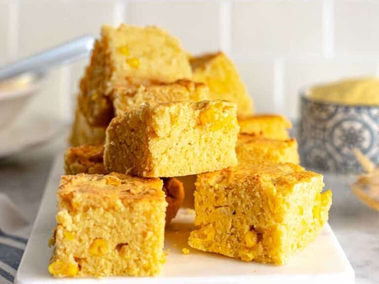 vegan cornbread sliced on a cutting board