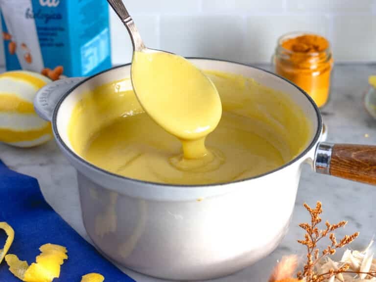 Creamy vegan custard in a white pot.