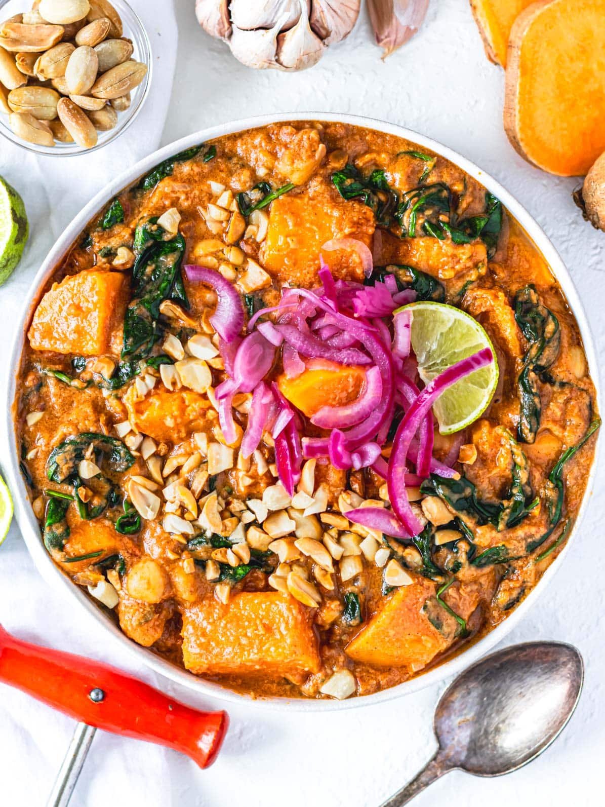 African peanut stew with sweet potatoes and a spoon.