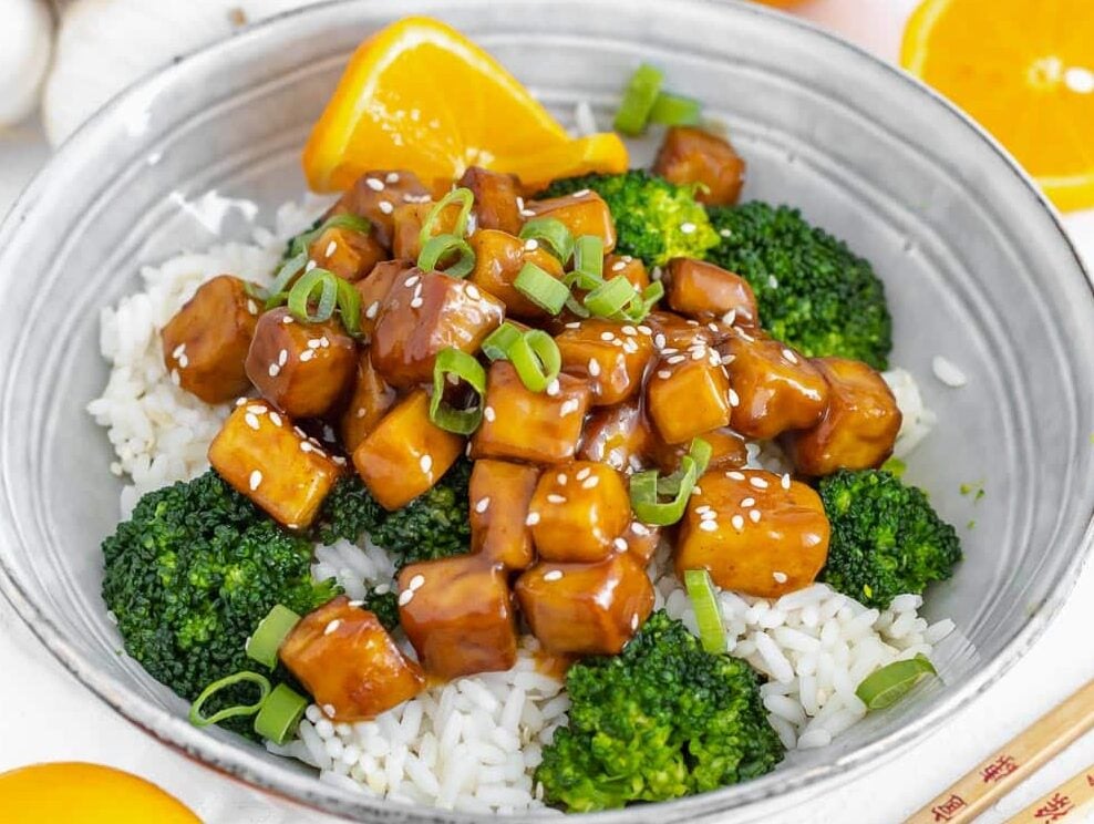 orange tofu with steamed broccoli on rice