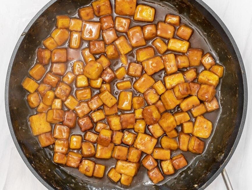 oven-baked tofu cubes coated in the orange sauce