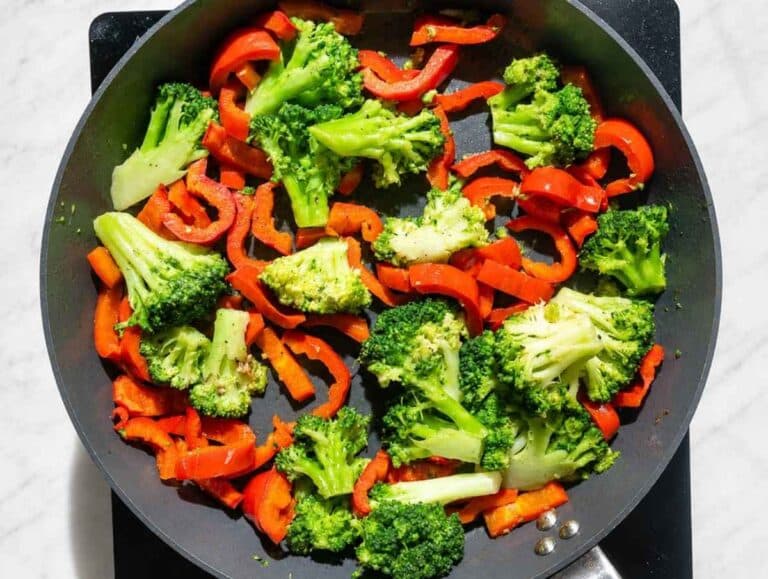 Step 2 Broccoli and red bell pepper cooking until bright and tender-crisp.