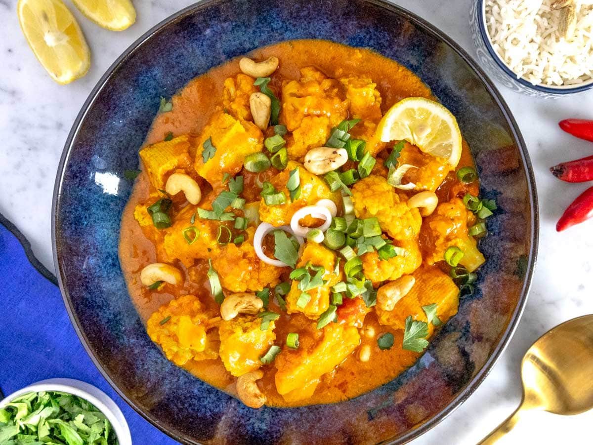 Tofu curry in a blue bowl.