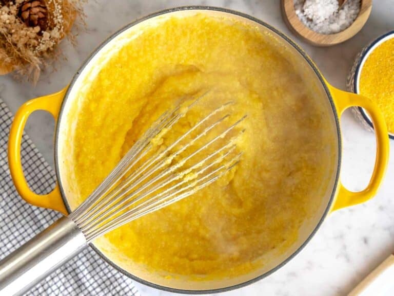 Cornmeal flour cooking in a cast iron pot.