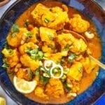 tofu curry with cauliflower and a golden spoon