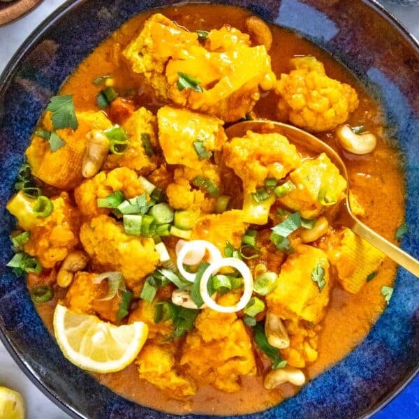 tofu curry with cauliflower and a golden spoon