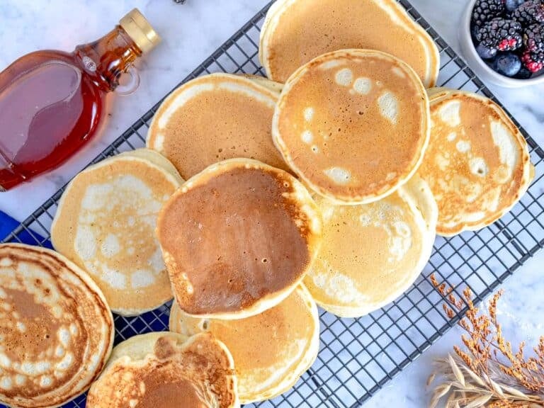 vegan pancakes cooling down on a grid.