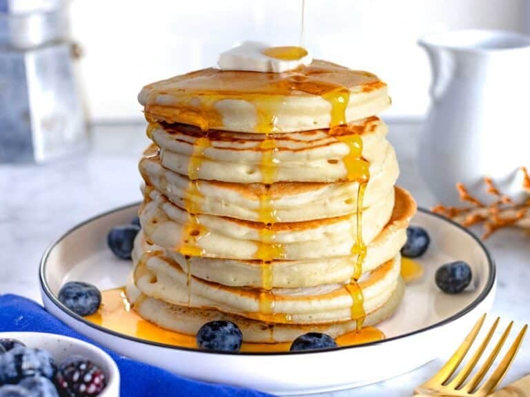 vegan pancakes with syrup and blueberries.