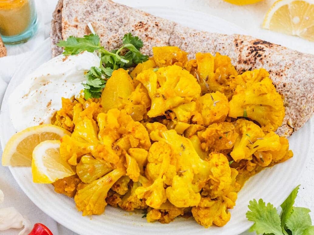 Aloo gobi with yogurt and naan bread