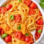 Cherry tomato pasta with juicy tomatoes, Parmesan, and fresh basil.