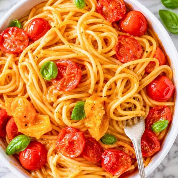 Cherry tomato pasta with juicy tomatoes, Parmesan, and fresh basil.