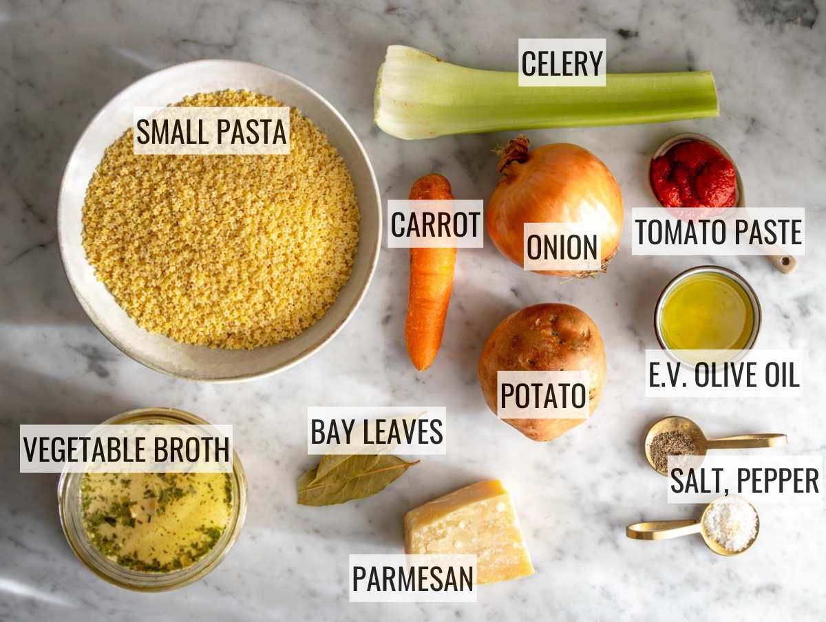 Ingredients for pastina on a marble surface.