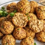 Italian-style lentil meatballs with golden edges and parsley.