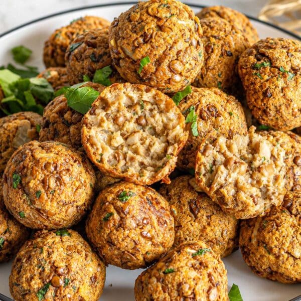 Italian-style lentil meatballs with golden edges and parsley.