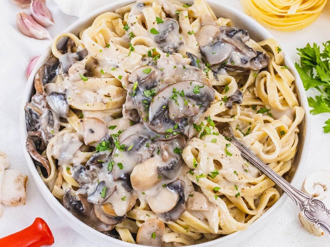 Mushroom Alfredo with fork and parsley