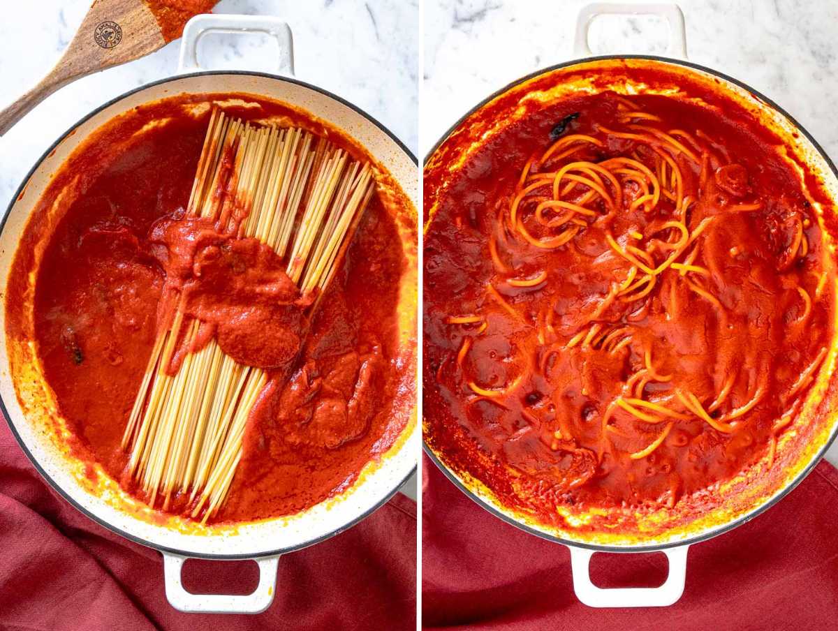 Adding spaghetti to assassin's sauce in a white skillet.