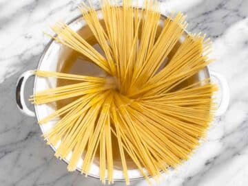 Step 1 Spaghetti cooking in a large pot of salted boiling water.