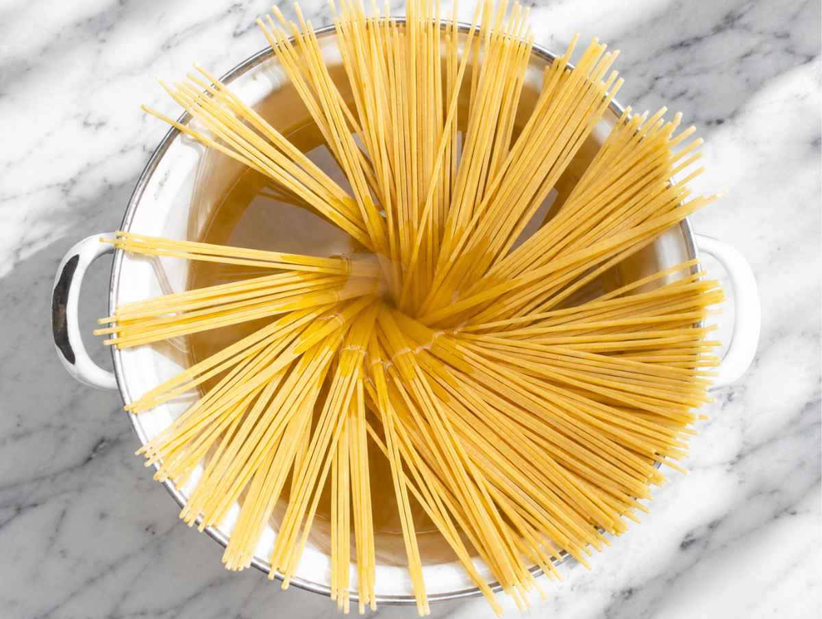 Step 1 Spaghetti cooking in a large pot of salted boiling water.
