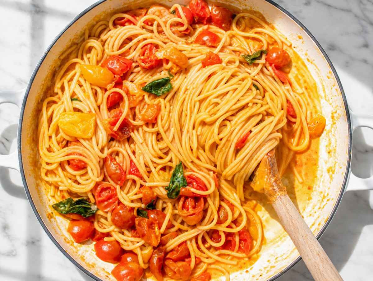 Step 3 Spaghetti tossed with burst tomatoes, pasta water, and fresh basil.