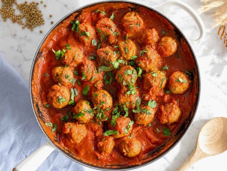 Step 4 Lentil meatballs simmering gently in marinara sauce before serving.