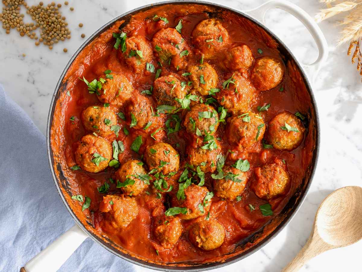 Step 4 Lentil meatballs simmering gently in marinara sauce before serving.