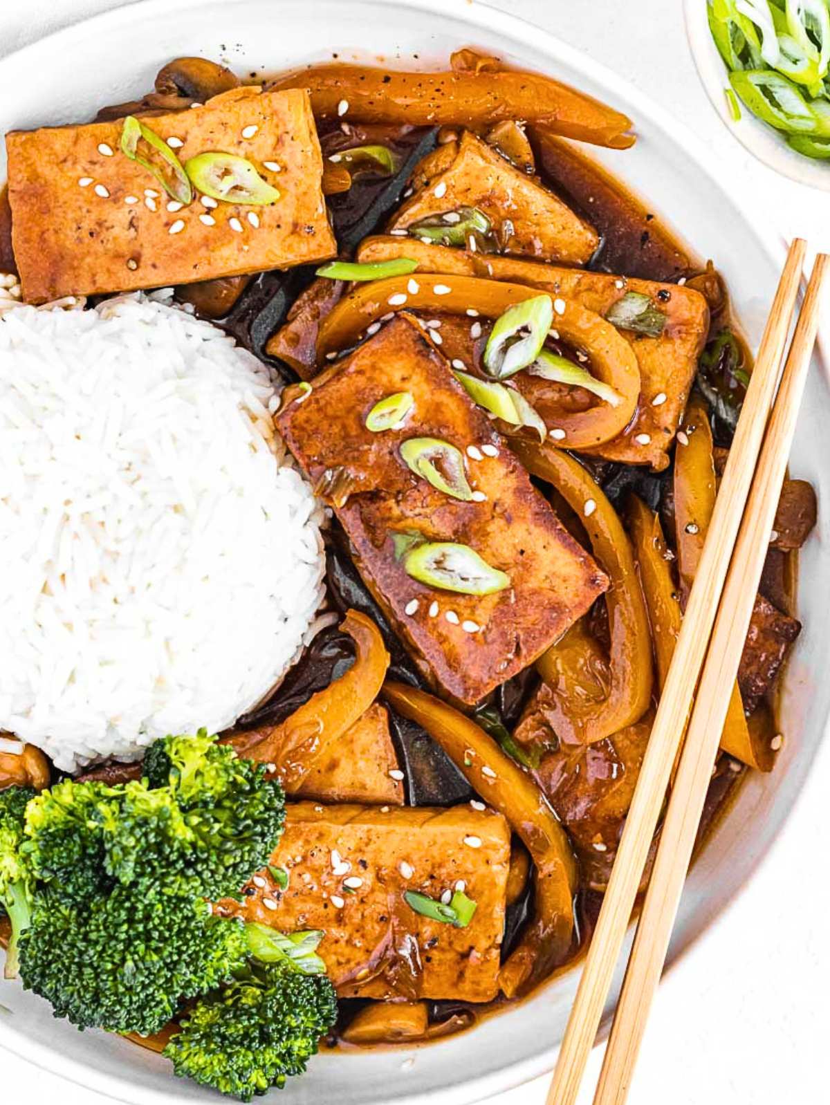 braised tofu with basmati rice and chopsticks.