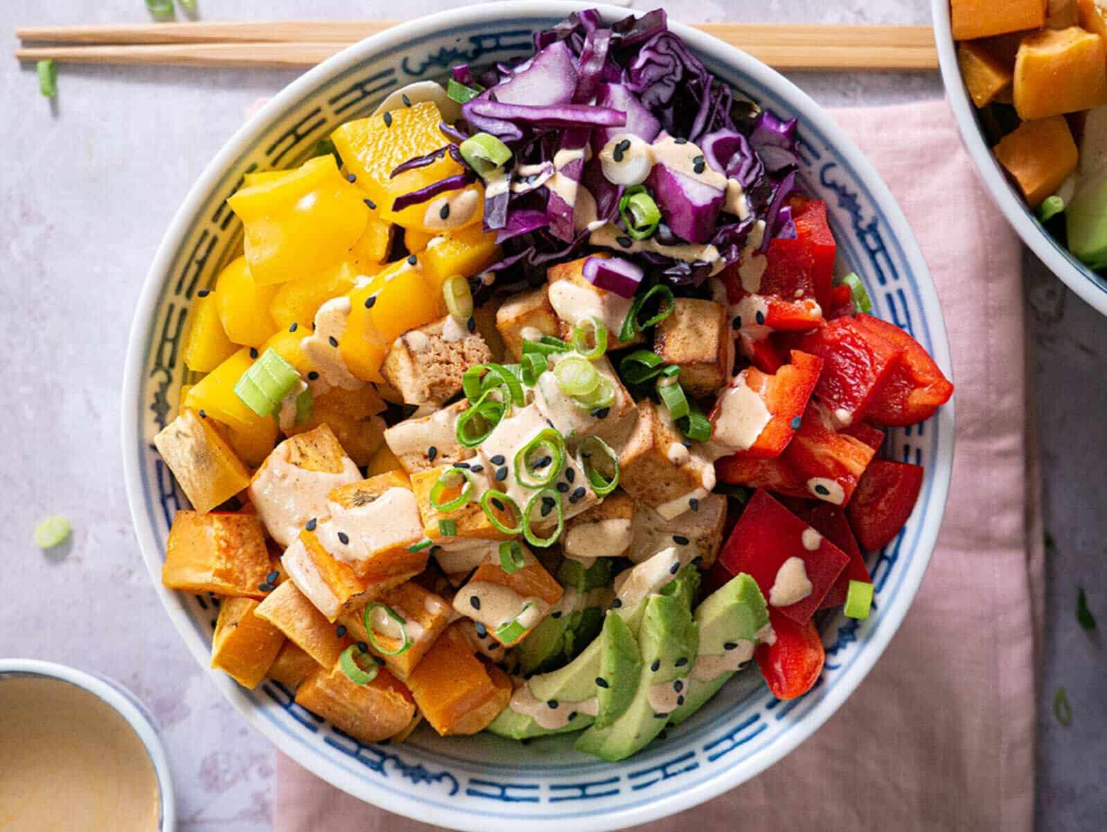 protein bowl with roasted sweet potato and chipotle sauce.