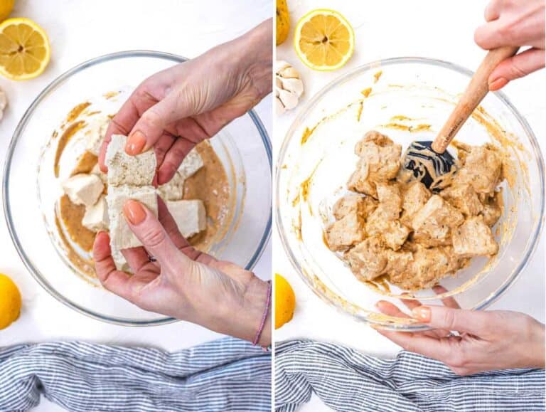 Breaking the tofu into pieces and coating it in the marinade.