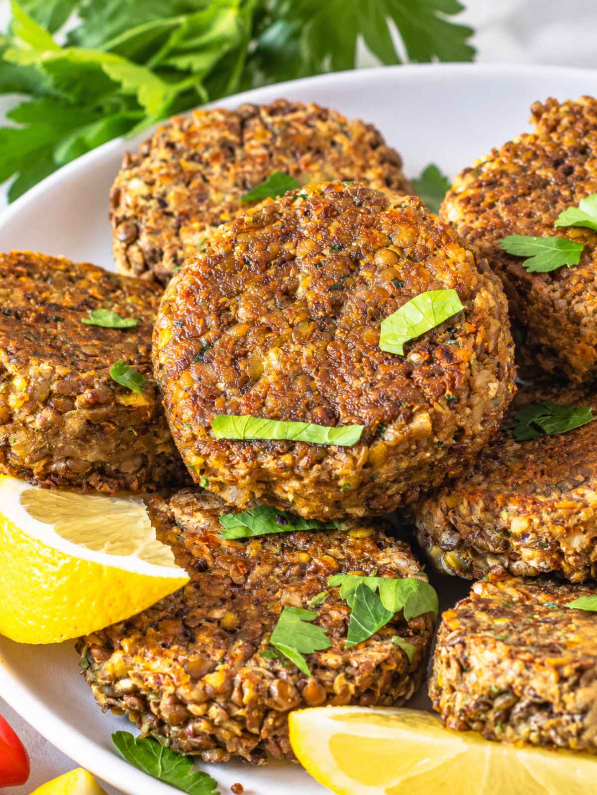 Close-up of lentil patties showing their crisp crust and textured lentil surface.