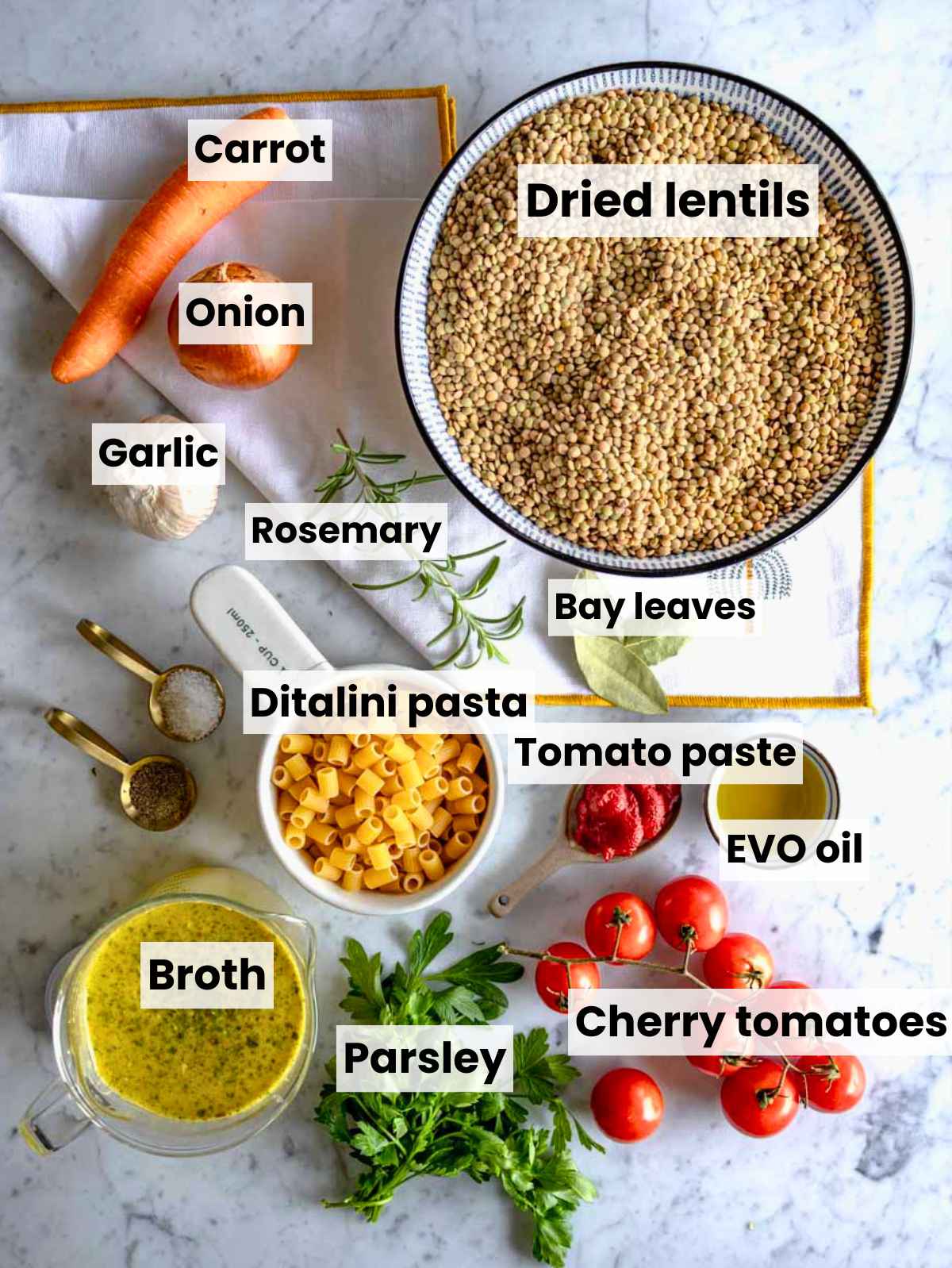 Lentil pasta ingredients arranged on a bright marble surface in natural light.