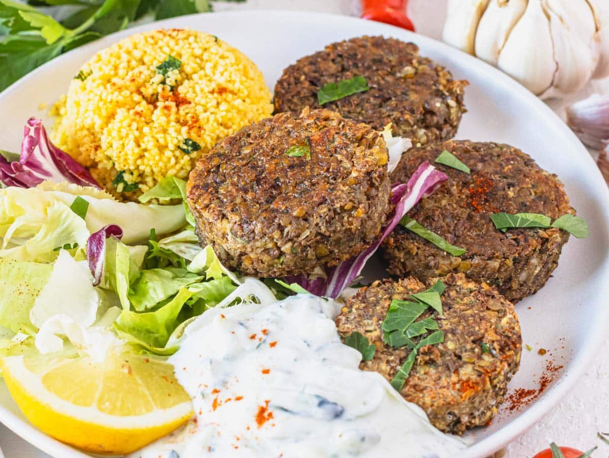 Pan fried lentil patties served with tzatziki sauce.