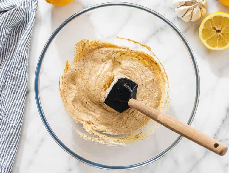 Step 1 Creamy yogurt marinade whisked with herbs, spices, garlic, and lemon juice.