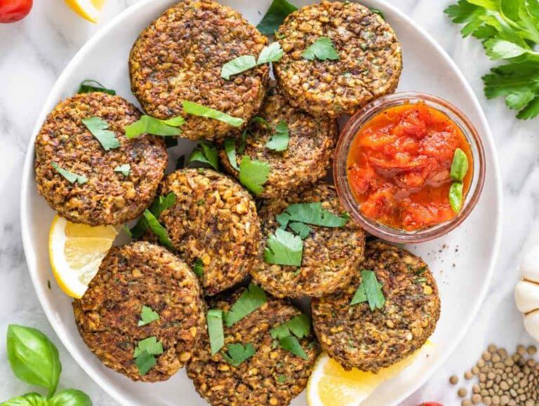 Step 4 Warm lentil patties served with fresh lemon wedges and marinara sauce.