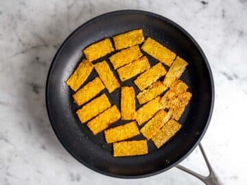 Cooking tempeh on a non-stick skillet.