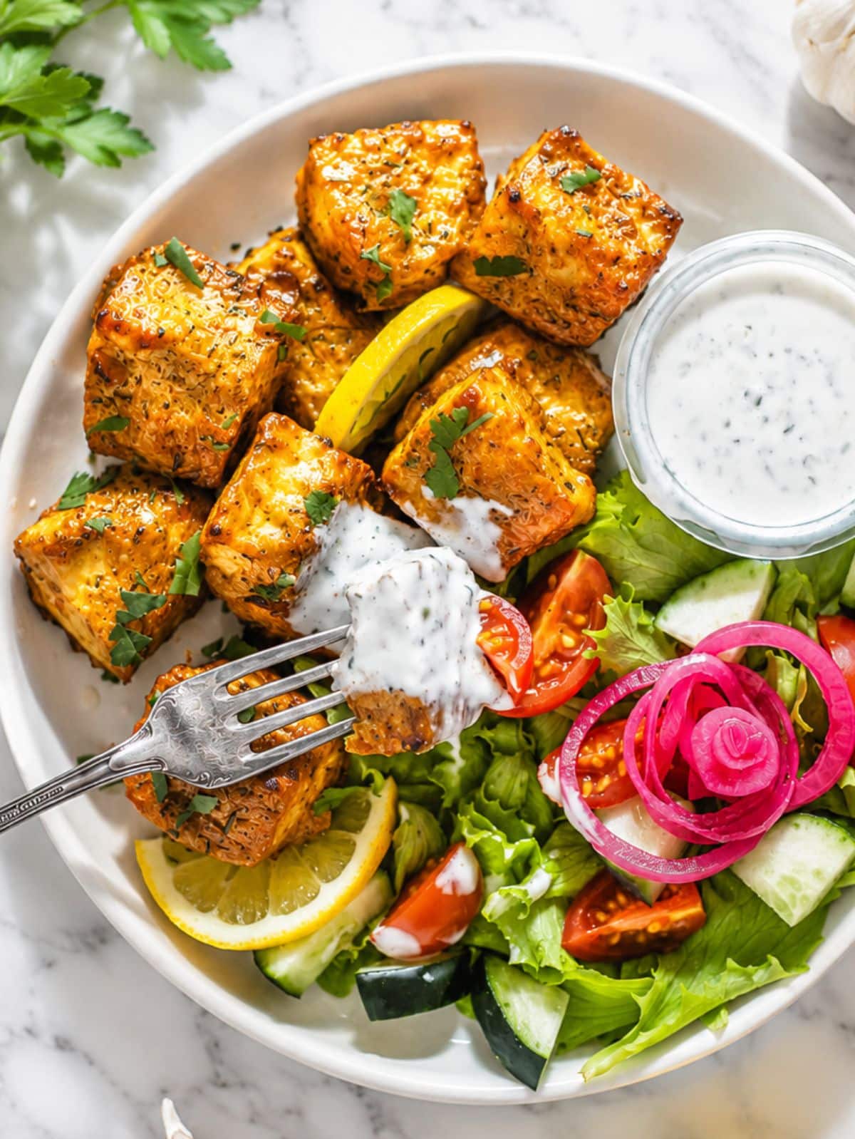 crispy marinated tofu and a green salad with ranch dressing.