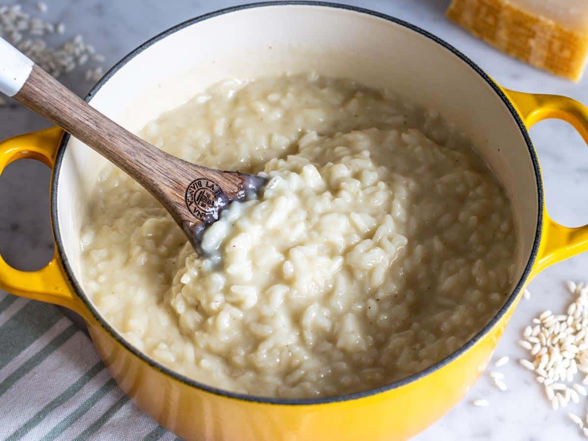 Parmesan risotto in a yellow pot.