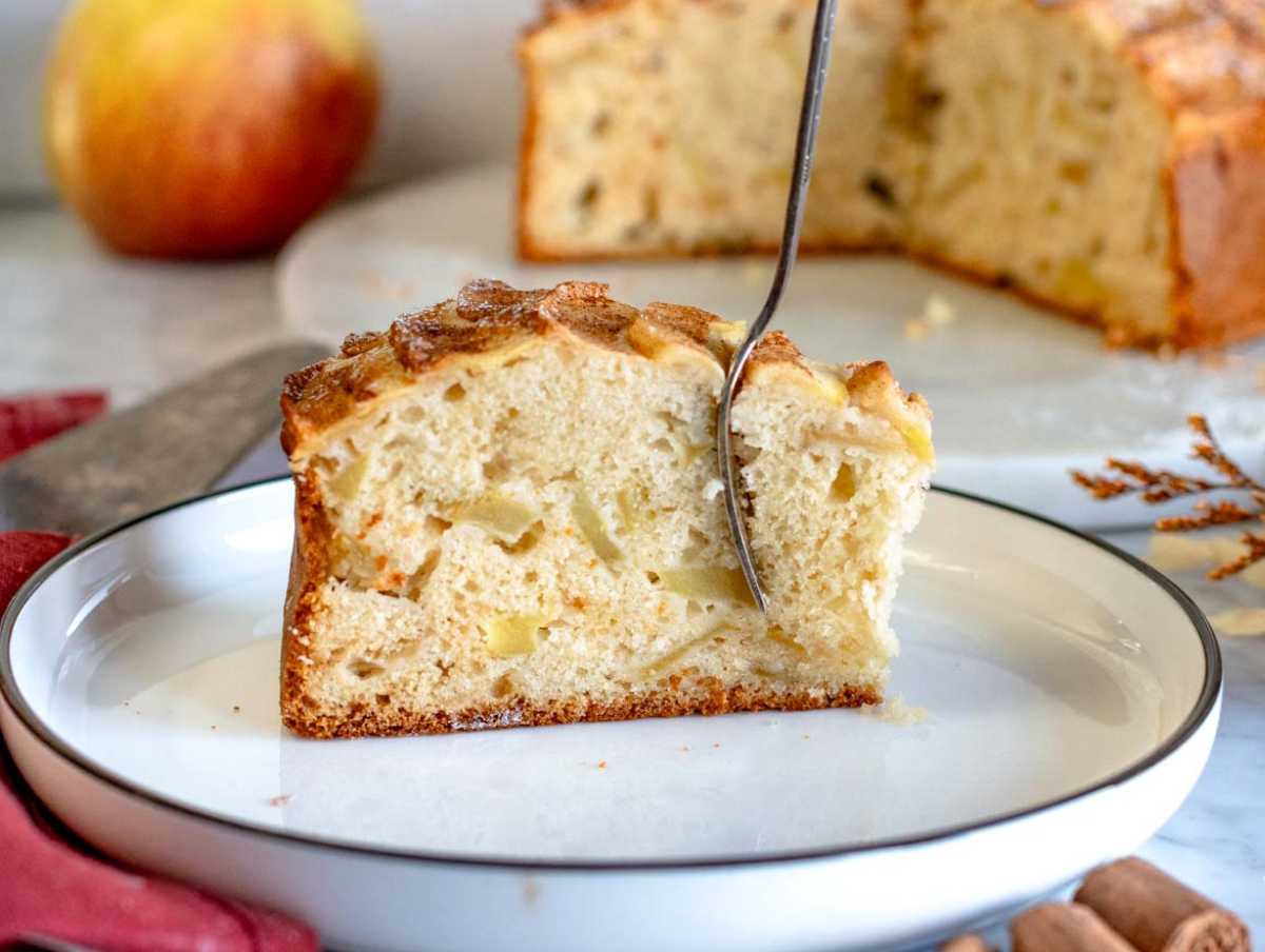 A slice of vegan apple cake on a plate.