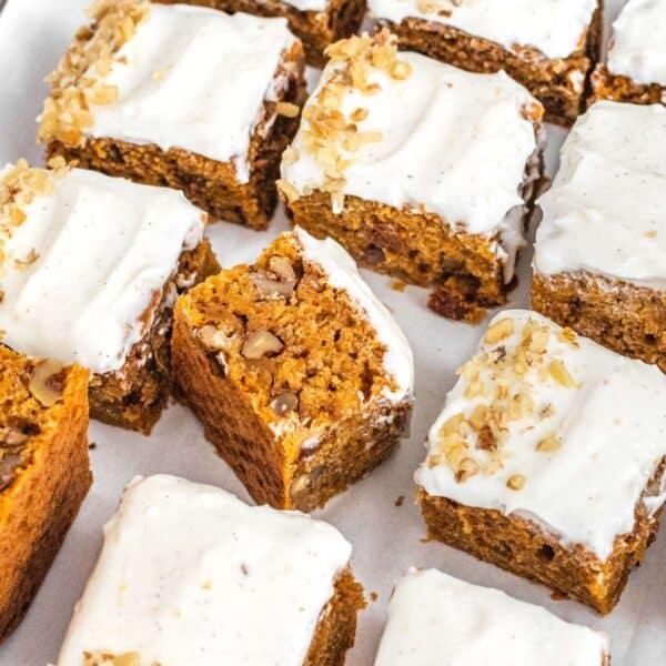 Carrot cake squares with frosting.